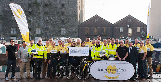 The team and crew presenting the cheque to Make-A-Wish Ireland